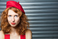 Red head, red beret, red braces